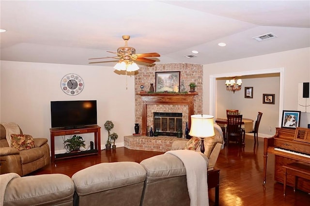 3444 Texas Ave, Kenner, LA 70065 - living room with lofted ceiling, wood finished floors, a chandelier, a ceiling fan, and a brick fireplace