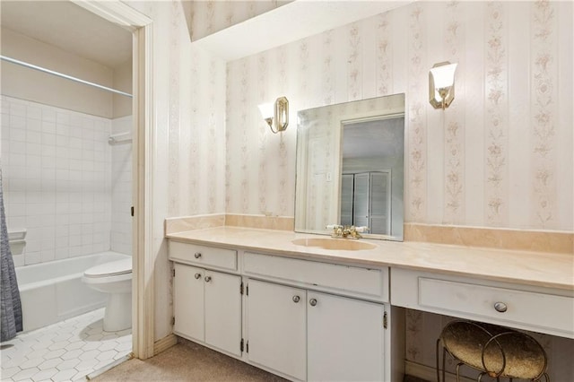 4909 Sunny Pl, Metairie, LA 70006 - bathroom with wallpapered walls, vanity,  shower combination, toilet, and tile patterned flooring