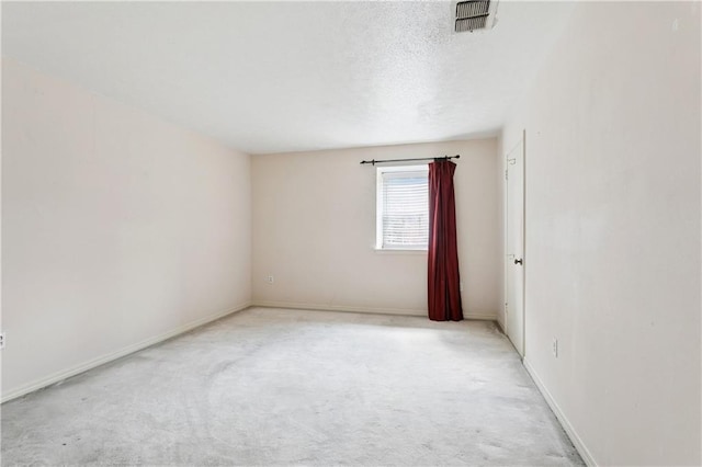 4909 Sunny Pl, Metairie, LA 70006 - carpeted spare room featuring a textured ceiling and baseboards