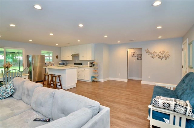 141 Audubon Dr, Mandeville, LA 70471 - living room featuring recessed lighting, light wood-type flooring, and baseboards