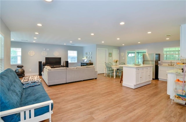 141 Audubon Dr, Mandeville, LA 70471 - living area featuring recessed lighting, light wood-style flooring, and baseboards