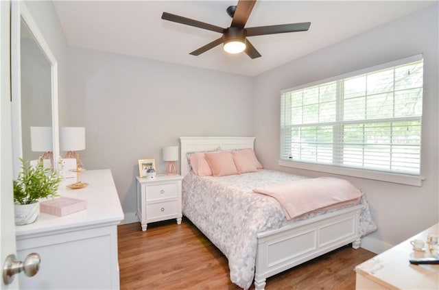 141 Audubon Dr, Mandeville, LA 70471 - bedroom with wood finished floors and a ceiling fan