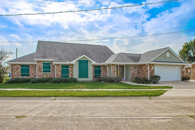 6300 W Metairie Ave, Metairie, LA 70003 - view of front of home featuring concrete driveway, an attached garage, brick siding, and a front lawn
