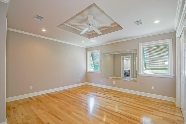 6300 W Metairie Ave, Metairie, LA 70003 - unfurnished room with light wood-type flooring, a tray ceiling, a ceiling fan, crown molding, and recessed lighting