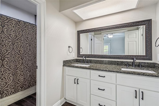 240 Silver Maple Dr, Mandeville, LA 70471 - bathroom with double vanity, wood finished floors, ceiling fan, and a shower with shower curtain