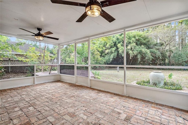 240 Silver Maple Dr, Mandeville, LA 70471 - unfurnished sunroom featuring a ceiling fan, healthy amount of natural light, and view of wooded area