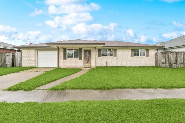 2716 Volpe Dr, Chalmette, LA 70043 - single story home featuring concrete driveway, a garage, and brick siding