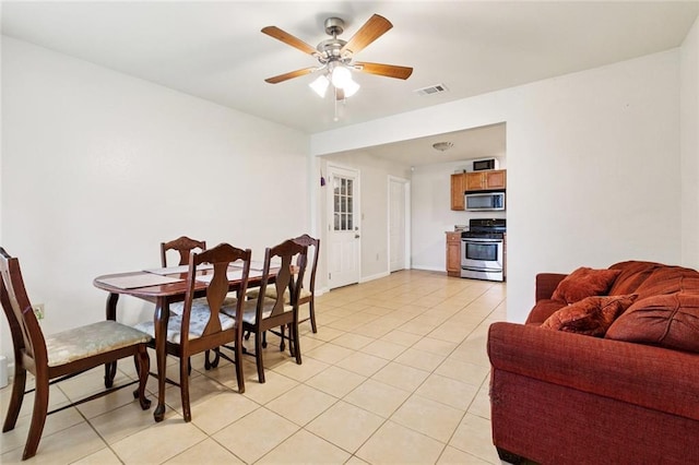 2716 Volpe Dr, Chalmette, LA 70043 - dining room featuring light tile patterned floors and ceiling fan