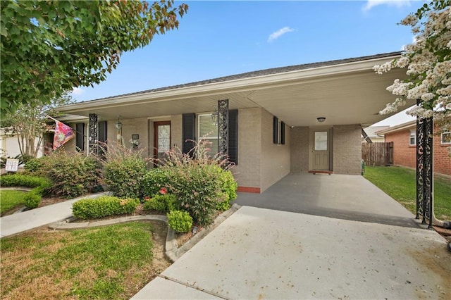 3913 Bellview St, Metairie, LA 70002 - view of front facade featuring a carport, brick siding, and concrete driveway