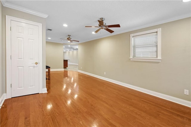 3913 Bellview St, Metairie, LA 70002 - empty room with a ceiling fan, ornamental molding, baseboards, recessed lighting, and wood finished floors