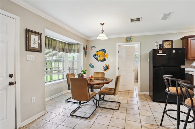 4811 Perelli Dr, New Orleans, LA 70127 - dining room with ornamental molding, plenty of natural light, light tile patterned floors, and baseboards