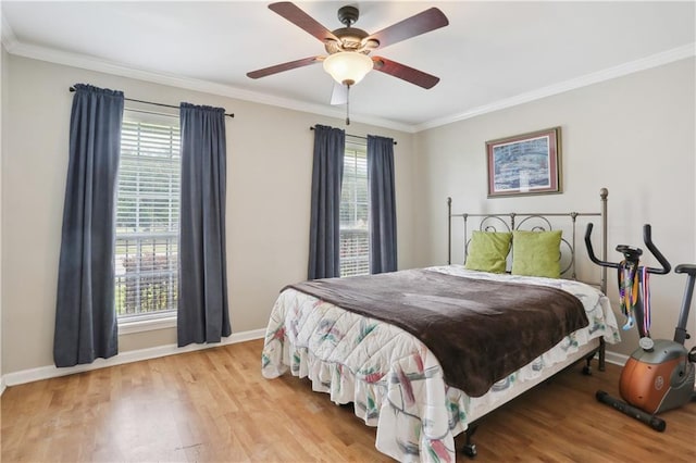 4811 Perelli Dr, New Orleans, LA 70127 - bedroom with baseboards, wood finished floors, crown molding, and a ceiling fan