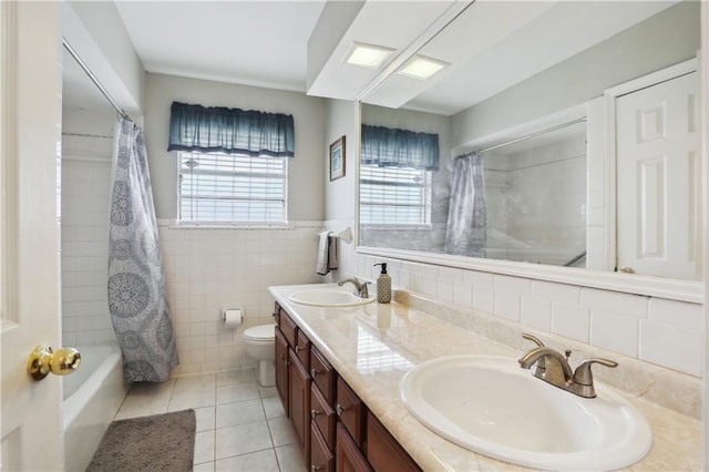 4811 Perelli Dr, New Orleans, LA 70127 - bathroom featuring tile patterned flooring, toilet, double vanity, tile walls, and shower / tub combo with curtain