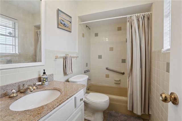 4811 Perelli Dr, New Orleans, LA 70127 - full bathroom featuring tile walls, vanity, shower / bath combo with shower curtain, and toilet