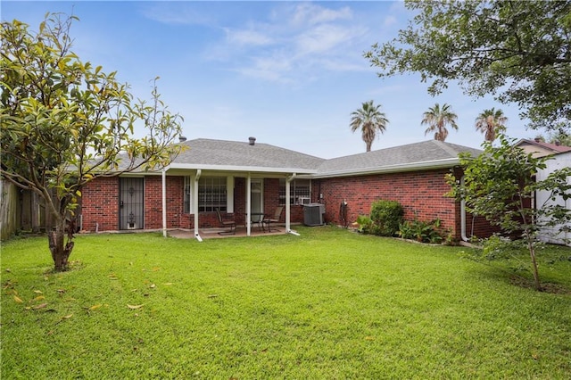 4811 Perelli Dr, New Orleans, LA 70127 - back of house with a patio, central AC, and brick siding