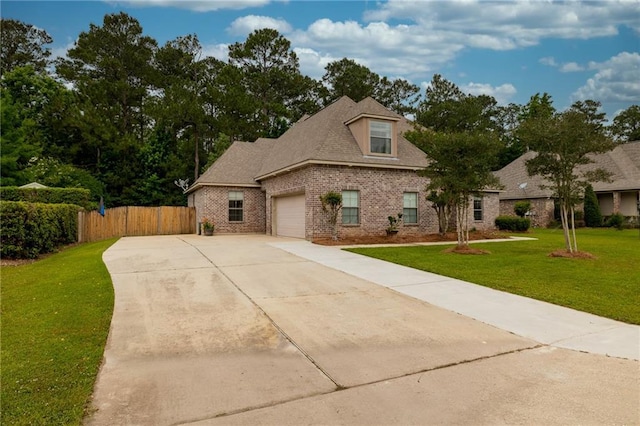 1180 Brook Ct, Mandeville, LA 70448 - view of front of house featuring brick siding, a garage, and driveway