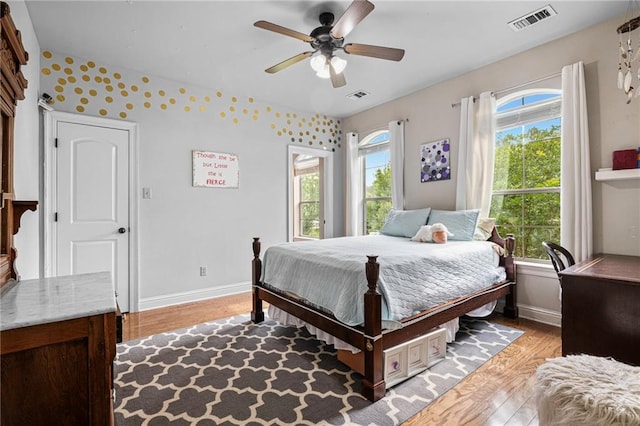 1180 Brook Ct, Mandeville, LA 70448 - bedroom featuring light wood finished floors, baseboards, and a ceiling fan