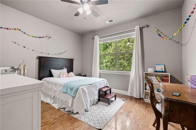 1180 Brook Ct, Mandeville, LA 70448 - bedroom featuring light wood finished floors, ceiling fan, and baseboards
