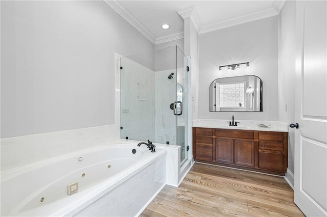 1180 Brook Ct, Mandeville, LA 70448 - bathroom featuring crown molding, a shower stall, a whirlpool tub, vanity, and wood finished floors