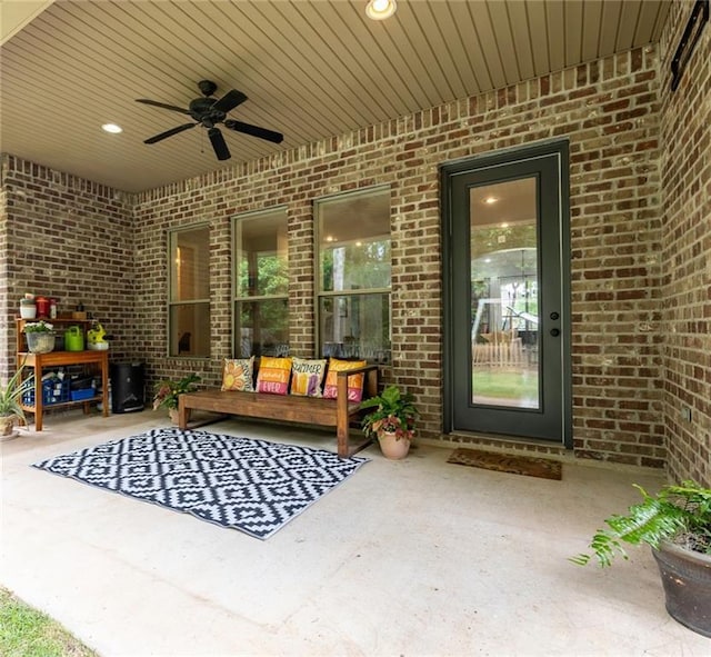 1180 Brook Ct, Mandeville, LA 70448 - view of patio featuring ceiling fan and an outdoor living space