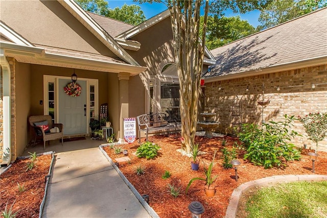 47380 Cardinal Dr, Franklinton, LA 70438 - entrance to property with stucco siding, a shingled roof, and brick siding