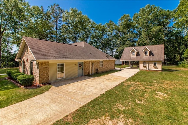 47380 Cardinal Dr, Franklinton, LA 70438 - cape cod house with concrete driveway, brick siding, a front yard, and a shingled roof