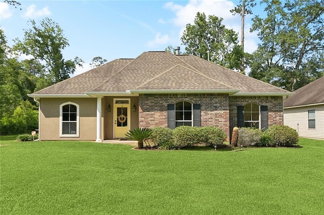 1216 W 23rd Ave, Covington, LA 70433 - view of front facade with a front lawn, a shingled roof, brick siding, and stucco siding