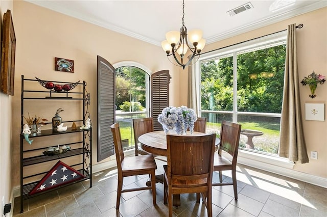 1216 W 23rd Ave, Covington, LA 70433 - dining space featuring a chandelier, ornamental molding, and baseboards