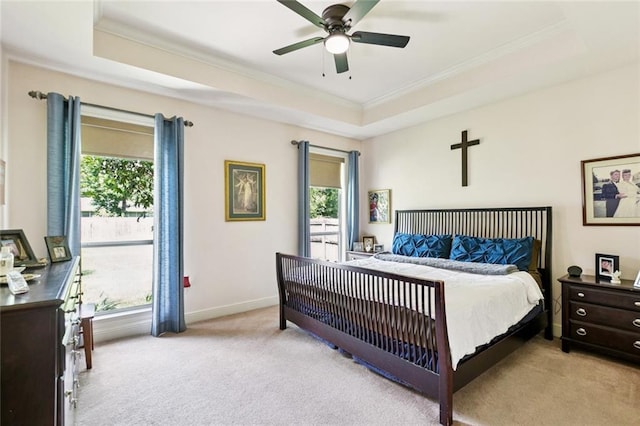 1216 W 23rd Ave, Covington, LA 70433 - bedroom with light colored carpet, a raised ceiling, crown molding, multiple windows, and baseboards