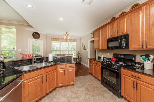 39749 Mark Ct, Ponchatoula, LA 70454 - kitchen with black appliances, a sink, crown molding, brown cabinets, and ceiling fan