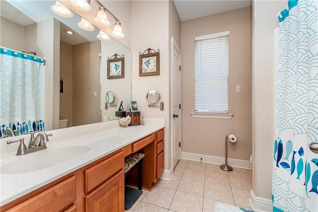 39749 Mark Ct, Ponchatoula, LA 70454 - bathroom with toilet, vanity, baseboards, and tile patterned floors