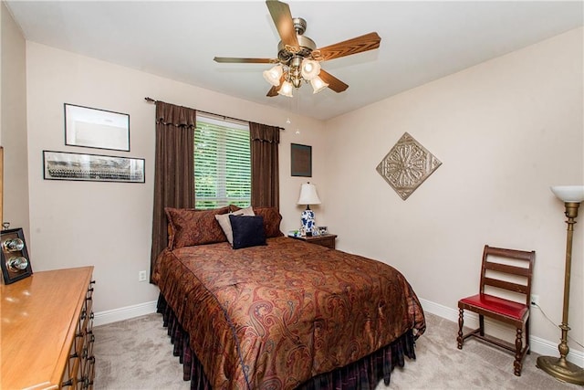 39749 Mark Ct, Ponchatoula, LA 70454 - bedroom featuring light carpet, baseboards, and a ceiling fan