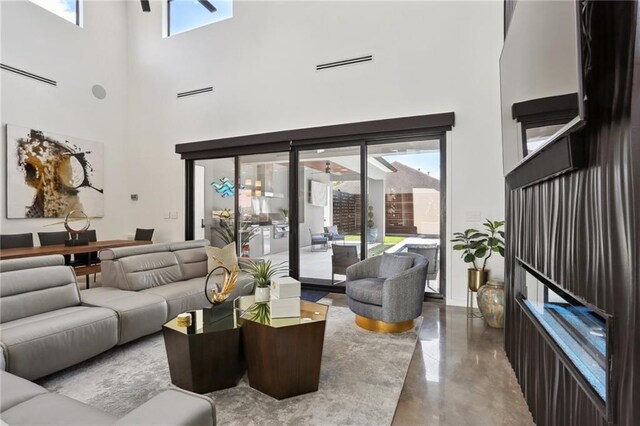 1900 Giuffrias Ave, Metairie, LA 70001 - living area with a high ceiling and finished concrete flooring