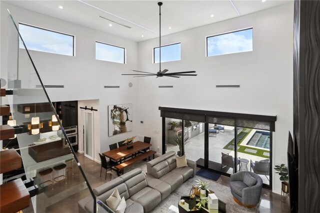 1900 Giuffrias Ave, Metairie, LA 70001 - living room with a high ceiling and a ceiling fan