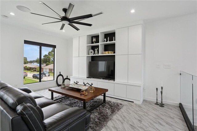 1900 Giuffrias Ave, Metairie, LA 70001 - living room with recessed lighting, built in shelves, baseboards, and ceiling fan