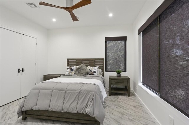 1900 Giuffrias Ave, Metairie, LA 70001 - bedroom with recessed lighting, a closet, ceiling fan, and marble finish flooring