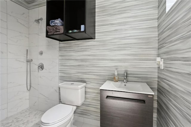 1900 Giuffrias Ave, Metairie, LA 70001 - bathroom with tile walls, vanity, toilet, and tiled shower
