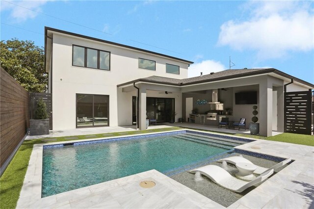 1900 Giuffrias Ave, Metairie, LA 70001 - rear view of property featuring stucco siding, a patio area, a ceiling fan, and an outdoor pool