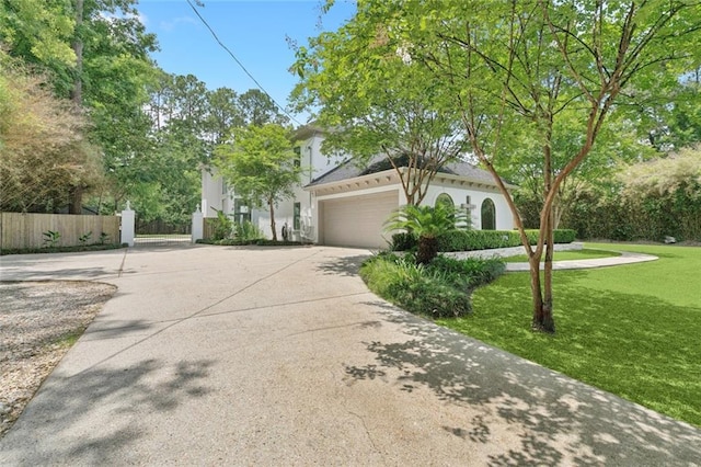 4 N Azalea Dr, Covington, LA 70433 - view of front of house with concrete driveway, a garage, and stucco siding