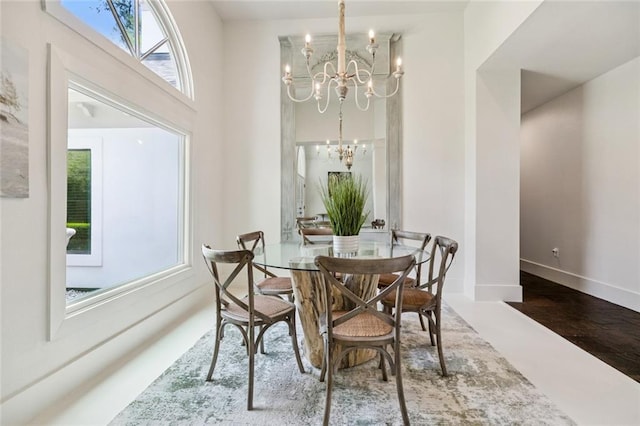 4 N Azalea Dr, Covington, LA 70433 - dining space with a chandelier, baseboards, and a towering ceiling