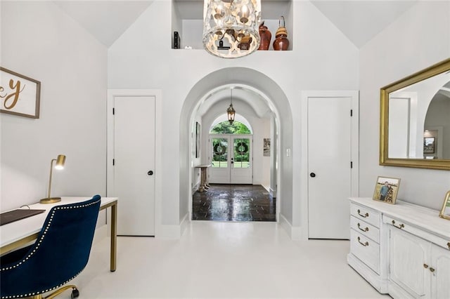 4 N Azalea Dr, Covington, LA 70433 - foyer featuring arched walkways, high vaulted ceiling, french doors, baseboards, and a chandelier