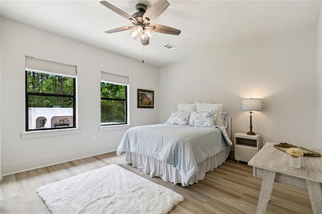 4 N Azalea Dr, Covington, LA 70433 - bedroom featuring light wood finished floors, baseboards, and a ceiling fan