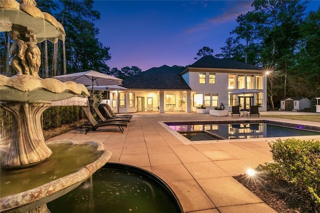 4 N Azalea Dr, Covington, LA 70433 - pool at dusk with a patio area and an outdoor pool