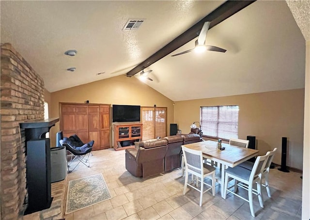 1912 Bullard Ave, Metairie, LA 70003 - living room with ceiling fan, light tile patterned flooring, a textured ceiling, and a wood stove