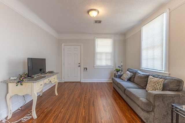 3962-64 Pauger St, New Orleans, LA 70122 - living room featuring dark wood-style flooring and baseboards