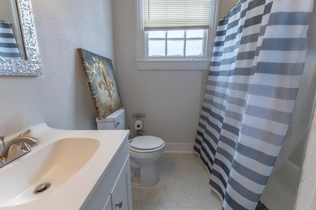 3962-64 Pauger St, New Orleans, LA 70122 - bathroom with vanity, toilet, and tile patterned flooring