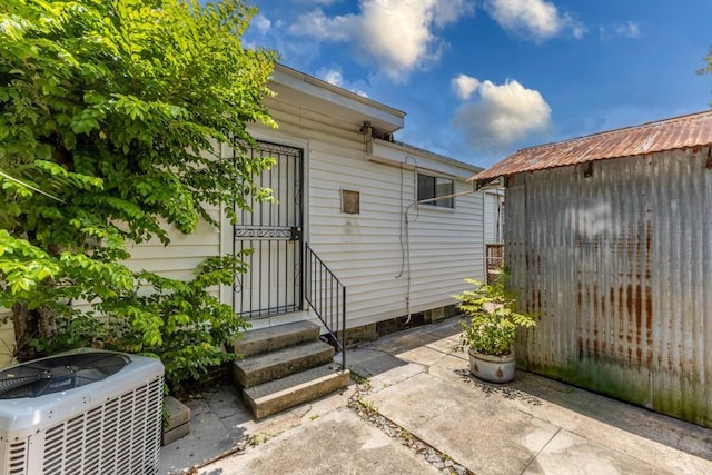 3962-64 Pauger St, New Orleans, LA 70122 - doorway to property with central AC unit