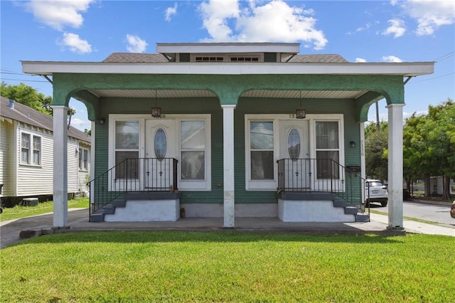 7328-30 Spruce St, New Orleans, LA 70118 - view of front of property featuring a front yard and a porch