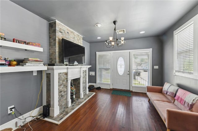 7328-30 Spruce St, New Orleans, LA 70118 - living room featuring hardwood / wood-style flooring, a chandelier, a large fireplace, baseboards, and recessed lighting