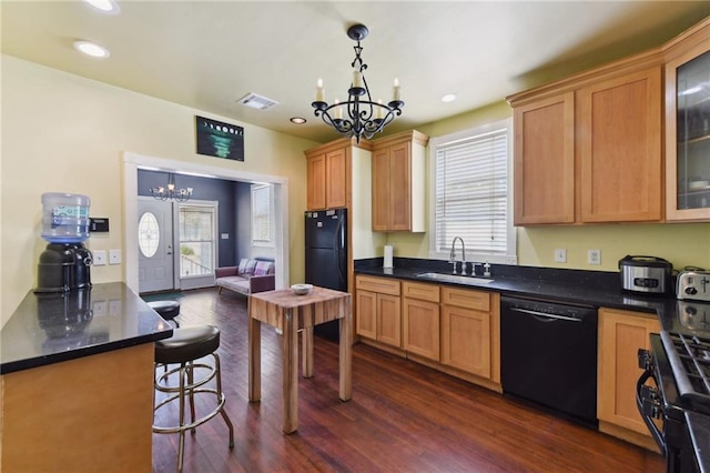 7328-30 Spruce St, New Orleans, LA 70118 - kitchen with black appliances, a chandelier, a sink, dark wood-style floors, and glass insert cabinets